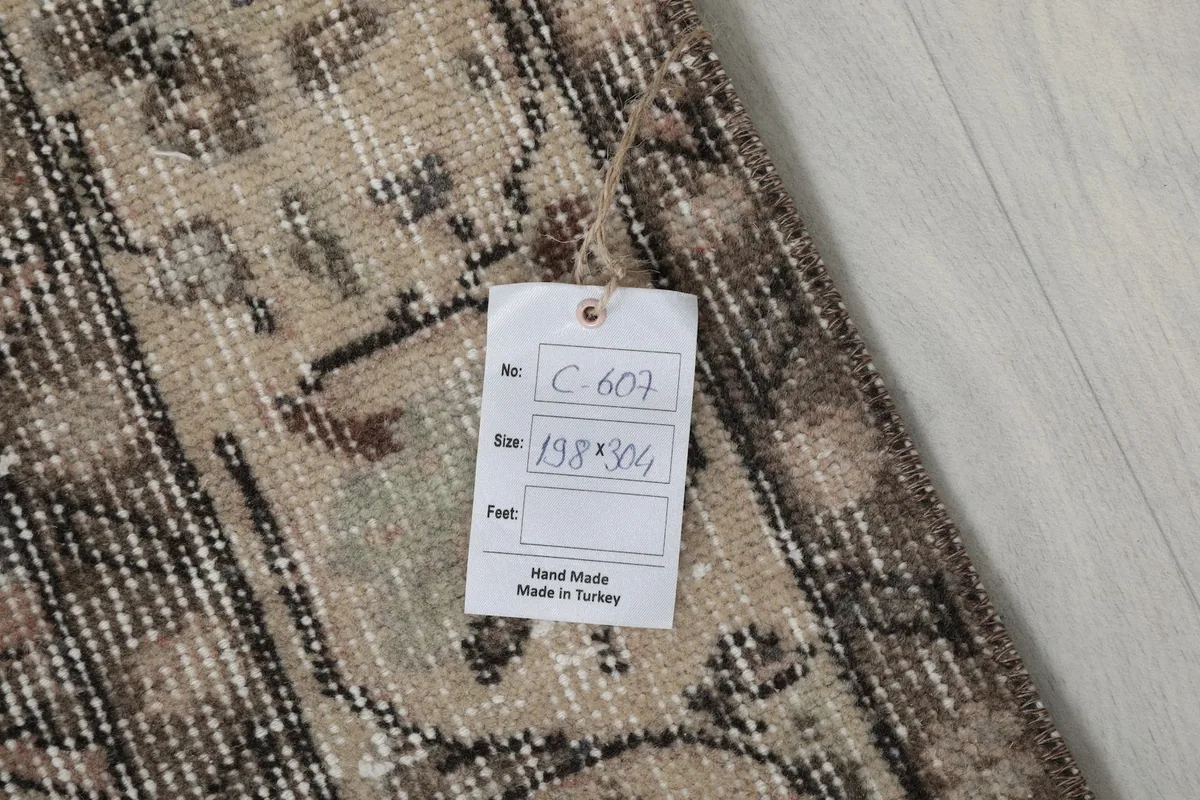 Close-up of the rug tag showing dimensions and origin