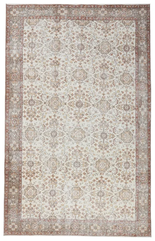 Full top view of the 5'9" x 9'4" ivory, rust, and brown floral vintage Anatolian rug