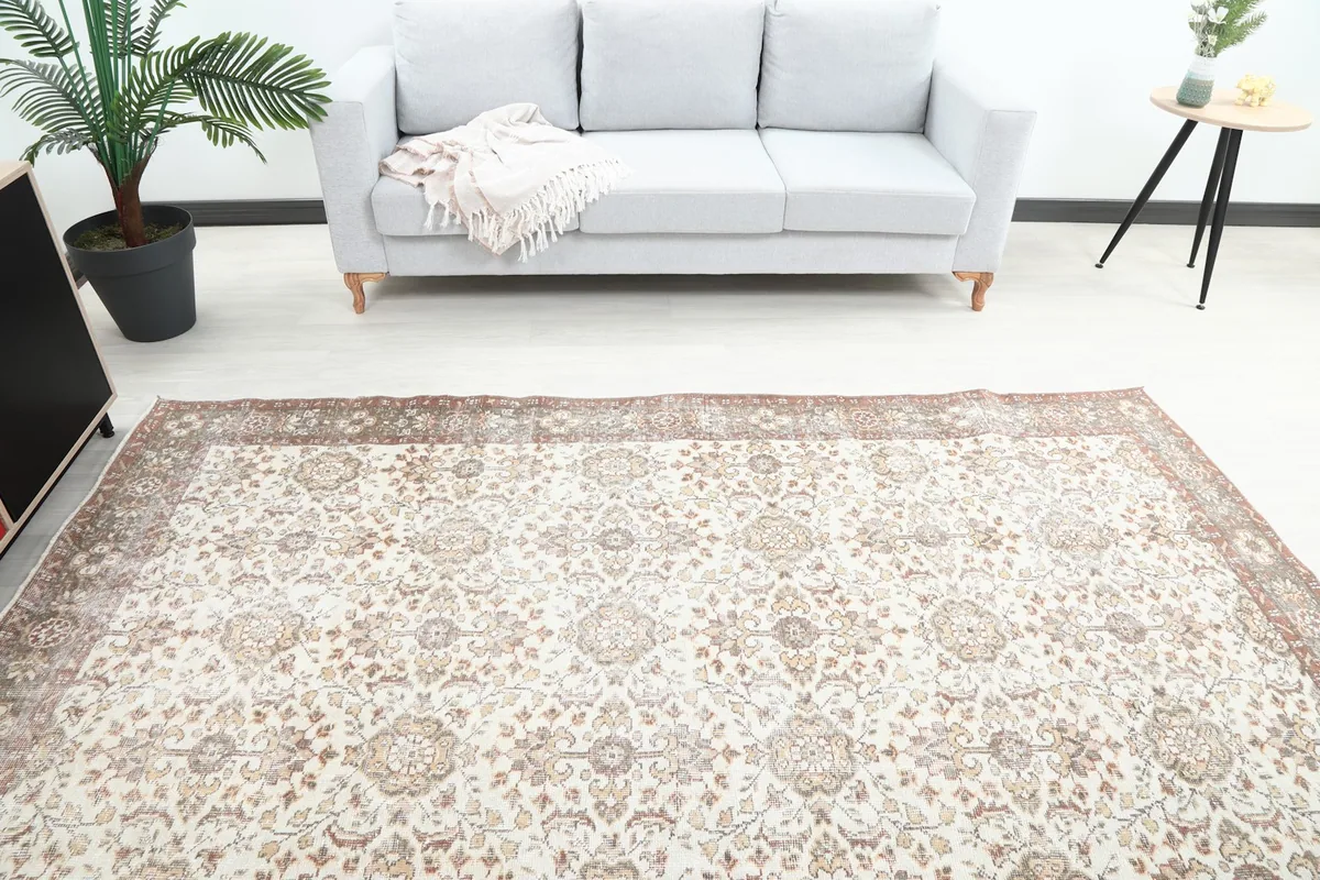 Overhead view of the rug in a room, highlighting its placement relative to a sofa and side table