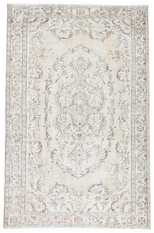 Full top view of the 6'1" x 9'5" ivory and brown vintage Anatolian area rug