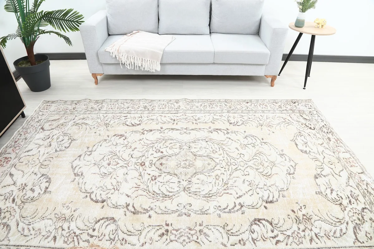 Overhead view of the rug in a room, showing its placement in front of a sofa