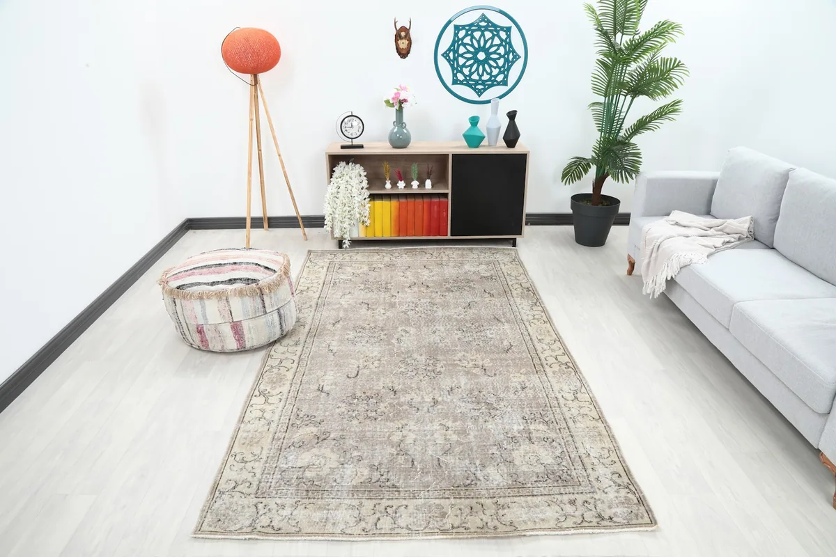 Anatolian rug displayed in a bright living room setup with a sofa and decor