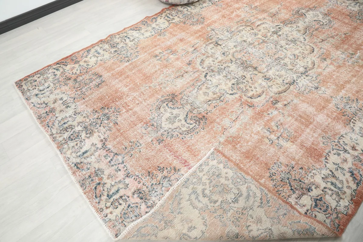 View of the rug's underside, revealing the cotton foundation and hand-knotted construction.
