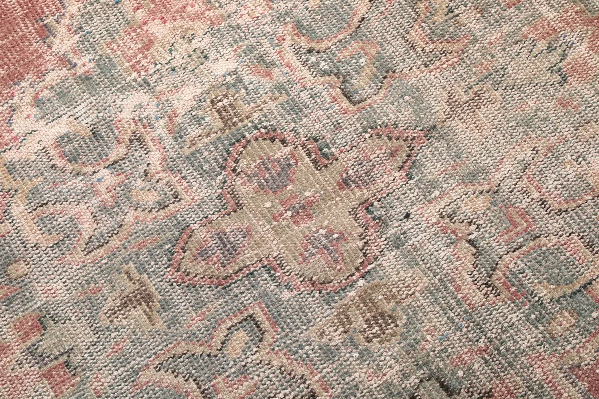 Detailed view of the hand-knotted wool pile, showing texture and subtle color variations