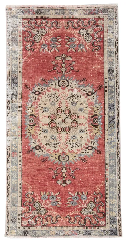Full top view of the rust vintage Anatolian area rug with an ivory medallion