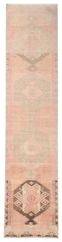 Full top view of the 2'10" x 12'8" rose geometric Anatolian runner rug on a white background.