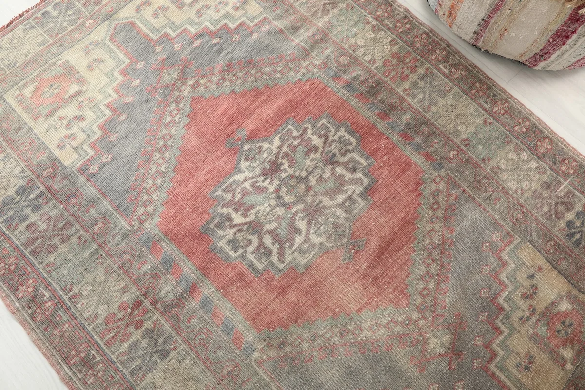 Detailed view of the central rose medallion with intricate floral and geometric elements.