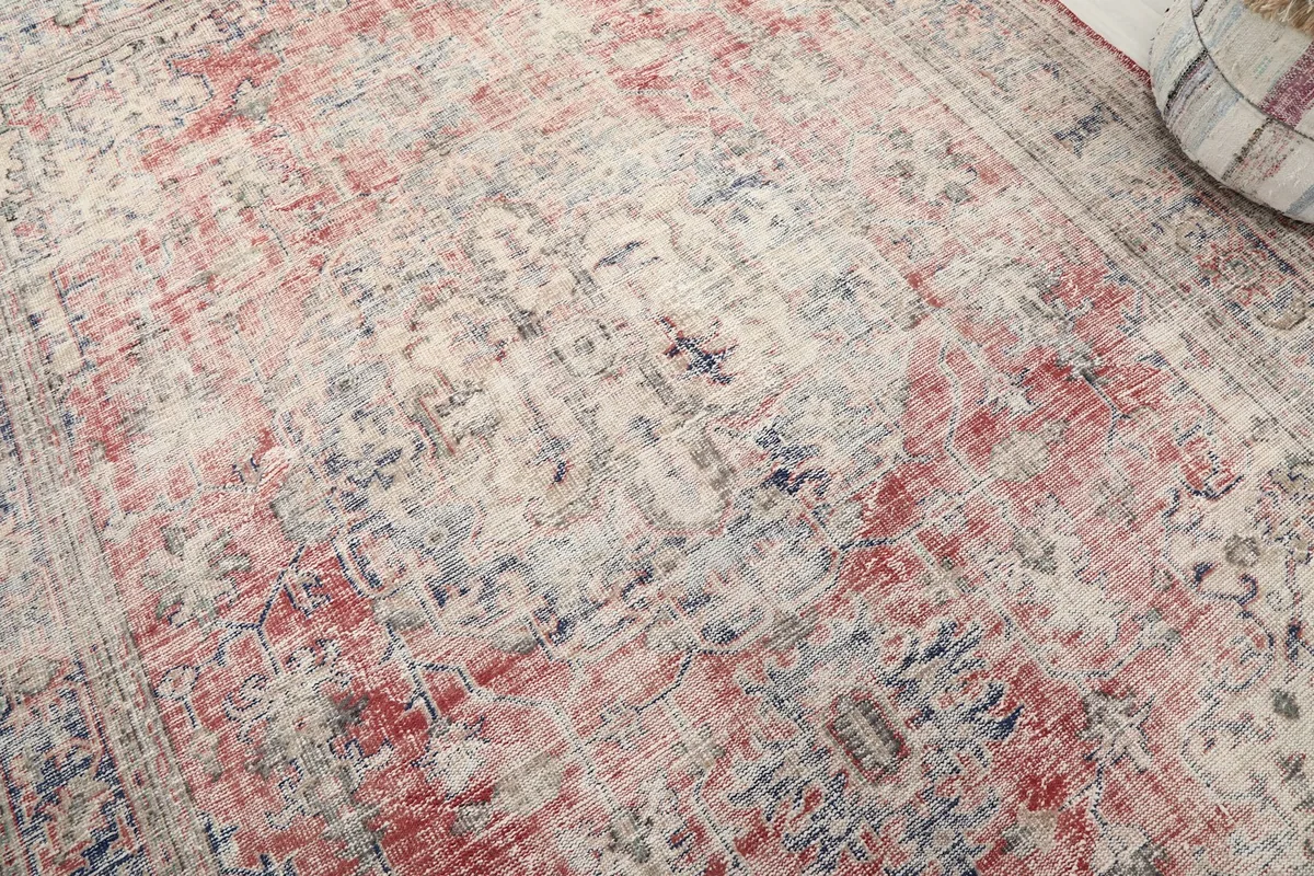 Close-up detail of the central medallion and distressed wool pile texture