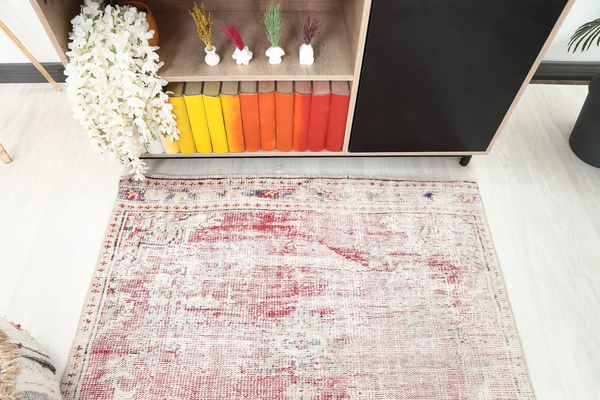 Top-down view of the rug's upper section, showcasing the central medallion and color variations.