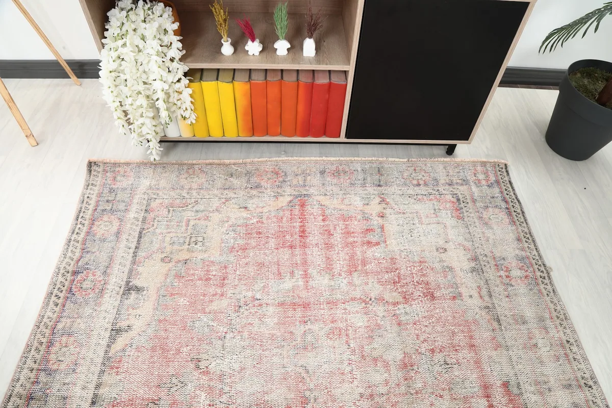 Diagonal view of the rug from above, highlighting the subtle color variations and border details