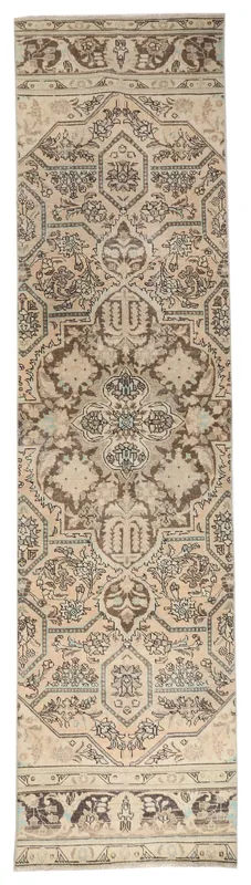 Full overhead view of the beige and brown vintage Anatolian runner rug with floral patterns