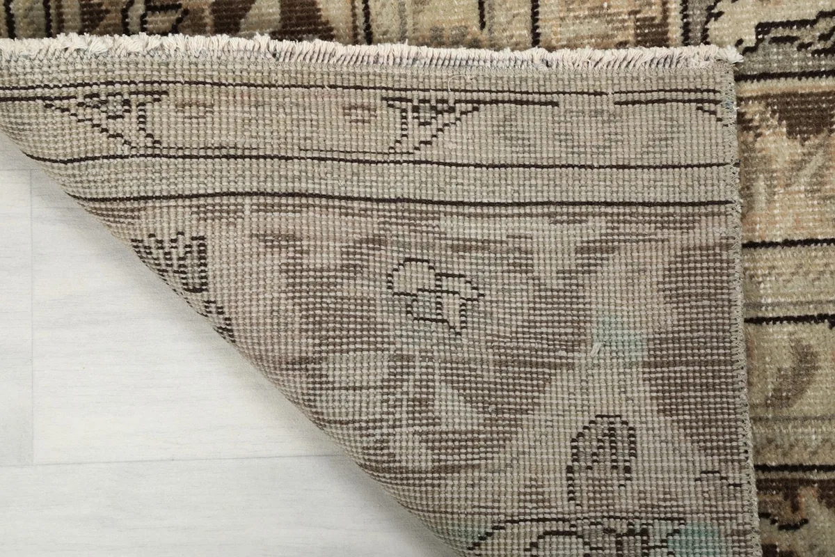 Underside view of the rug showing the hand-knotted cotton foundation