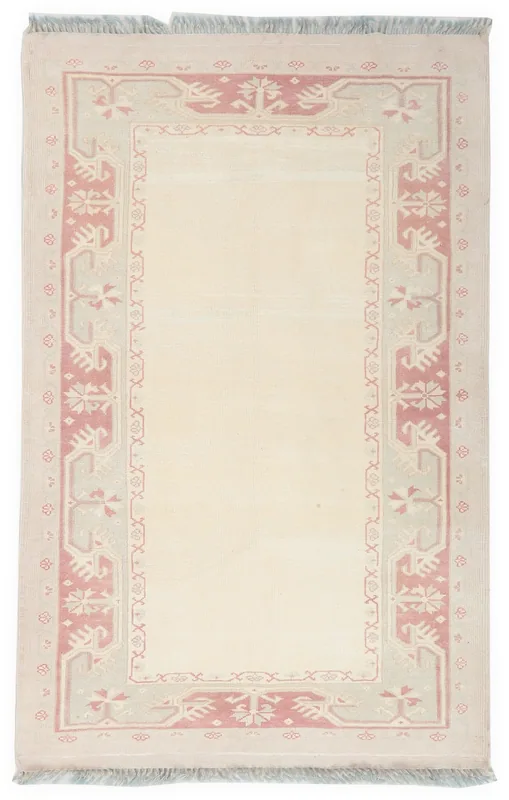 Full top view of the 4'1" x 6'5" ivory and rose vintage Anatolian rug