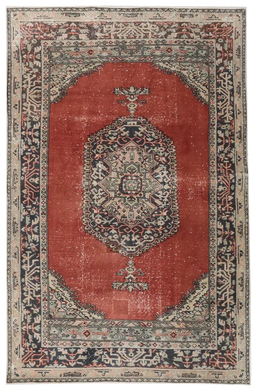 Full top view of the 4'10" x 7'5" vintage Anatolian area rug with rust field and central medallion.