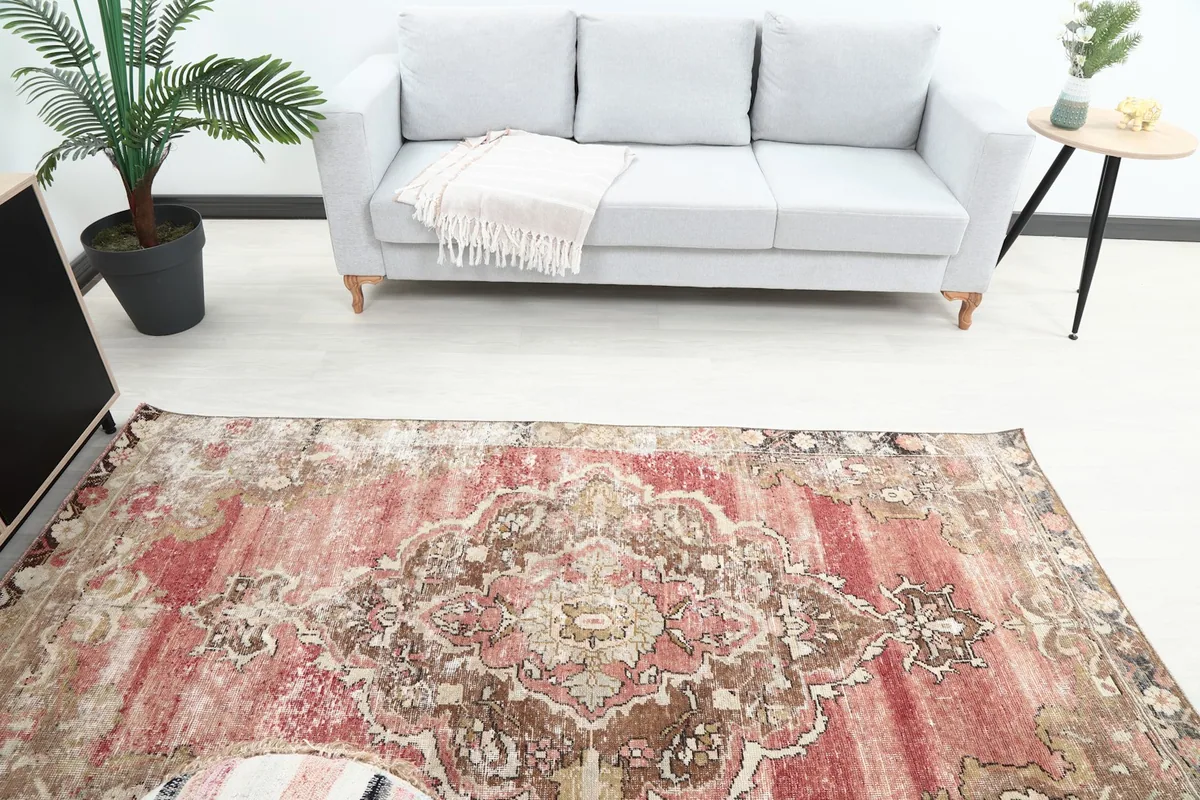 Overhead view of the rug in a room, showing its placement relative to a sofa