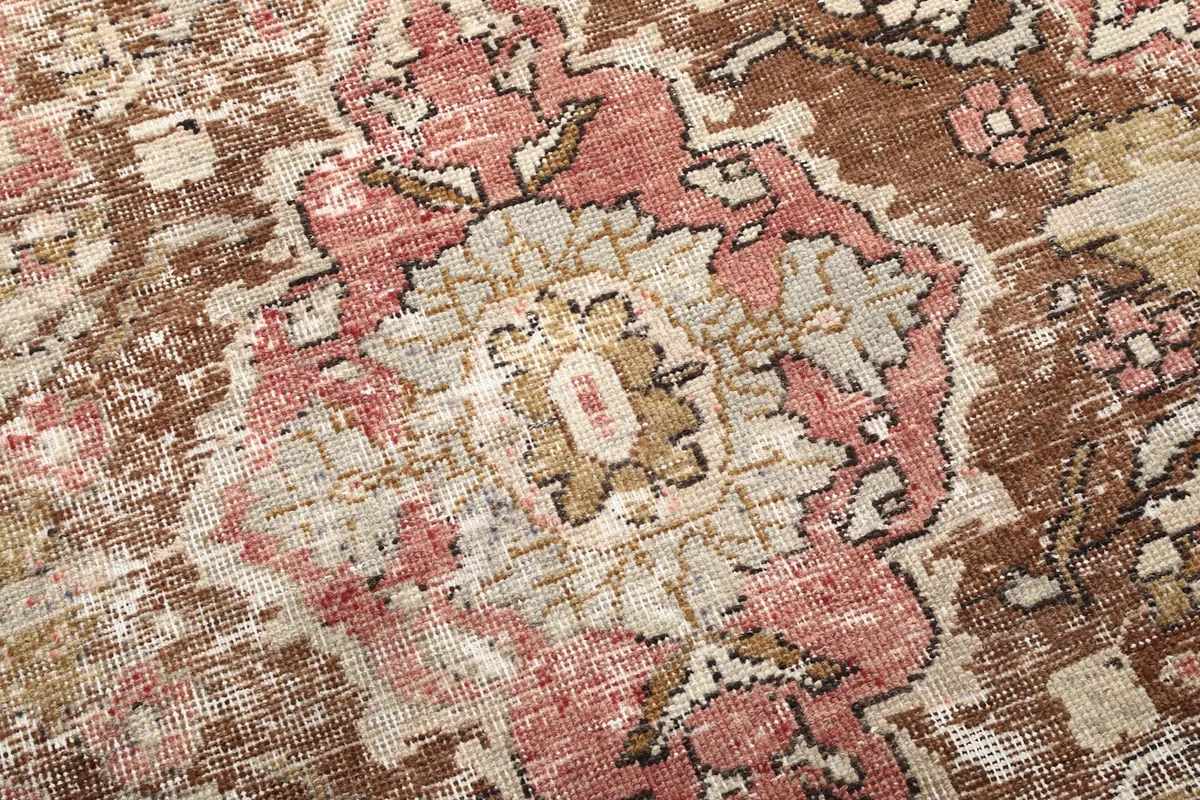 Close-up of the wool pile showing the intricate hand-knotted detail and natural wear