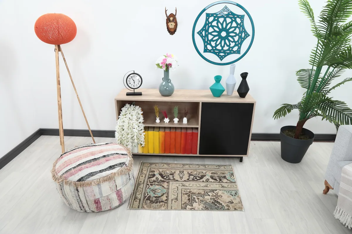 Vintage Anatolian rug in a room setting with light furniture and decor