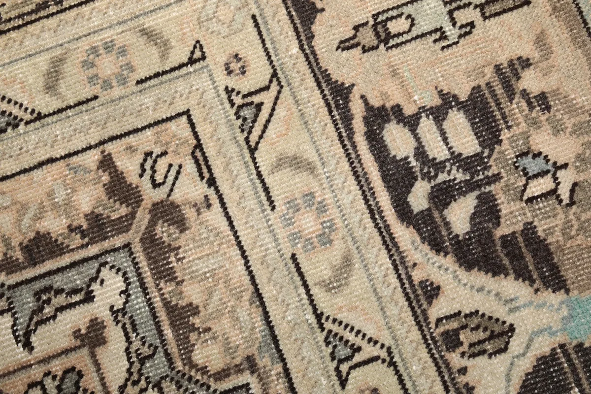 Close-up of the rug's surface, highlighting the hand-knotted wool pile and weave