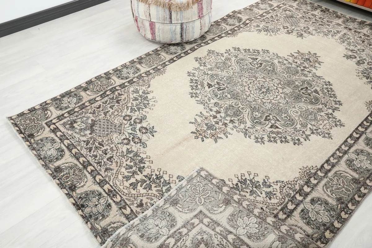 Angled view of the full rug, displaying the overall pattern and color balance from a lower perspective