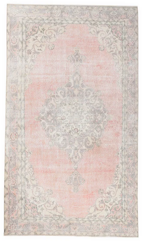Full top view of the 6'3" x 10'8" rose and gray vintage Anatolian area rug on a white background.