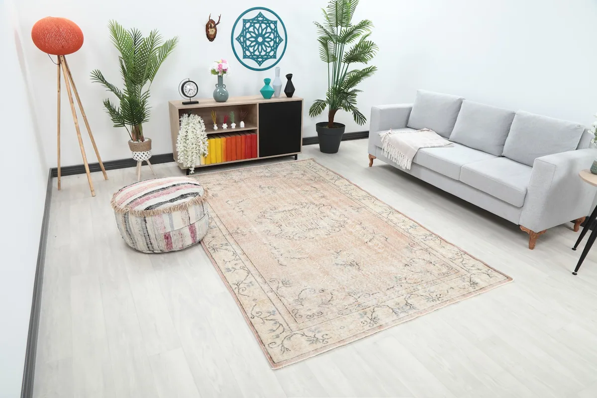 Another wide angle view of the rug in a living room, showing its scale relative to furniture and decor.