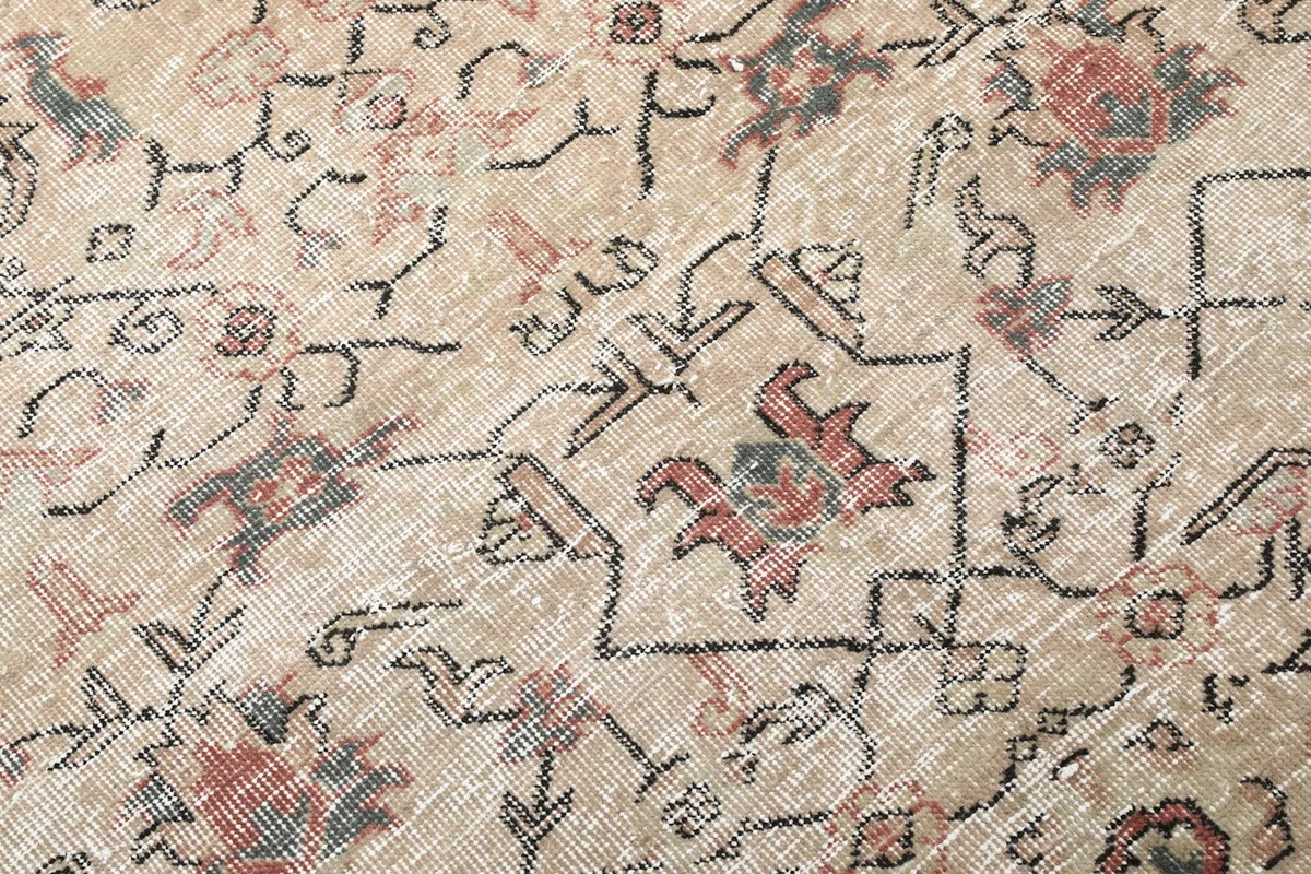 Extreme close-up of the intricate tribal knotting and color variation in the pile