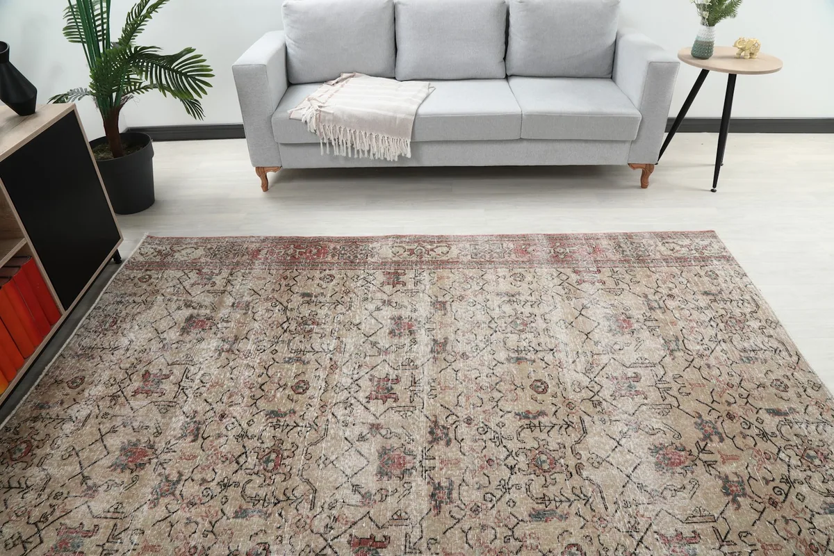 Overhead view of the vintage rug showcasing its full pattern and color variations