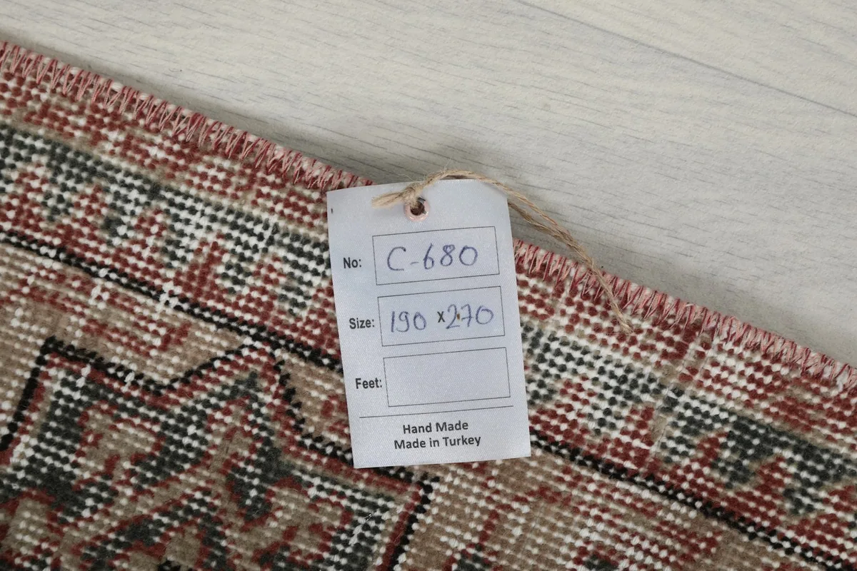 Product tag indicating the rug's origin (Hand Made in Turkey) and dimensions