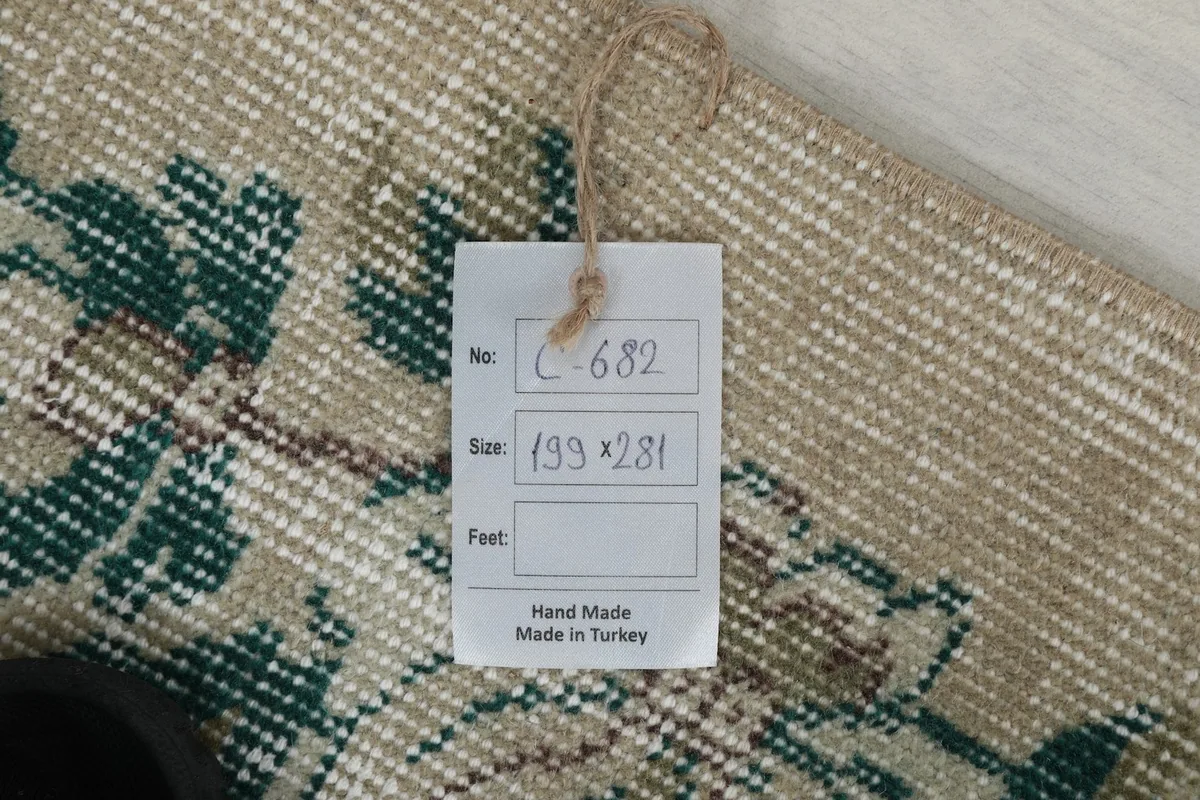 Product tag on the rug, displaying item number, dimensions, and 'Hand Made in Turkey' text.