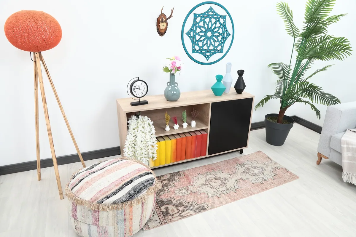 Wide view of the runner rug in a living space, showing its scale next to furniture