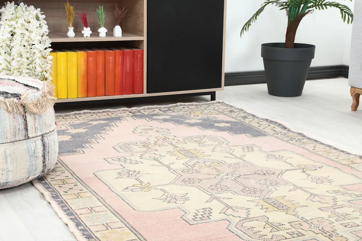 Close-up of the rug's corner in a room setting, showing texture and surrounding decor.