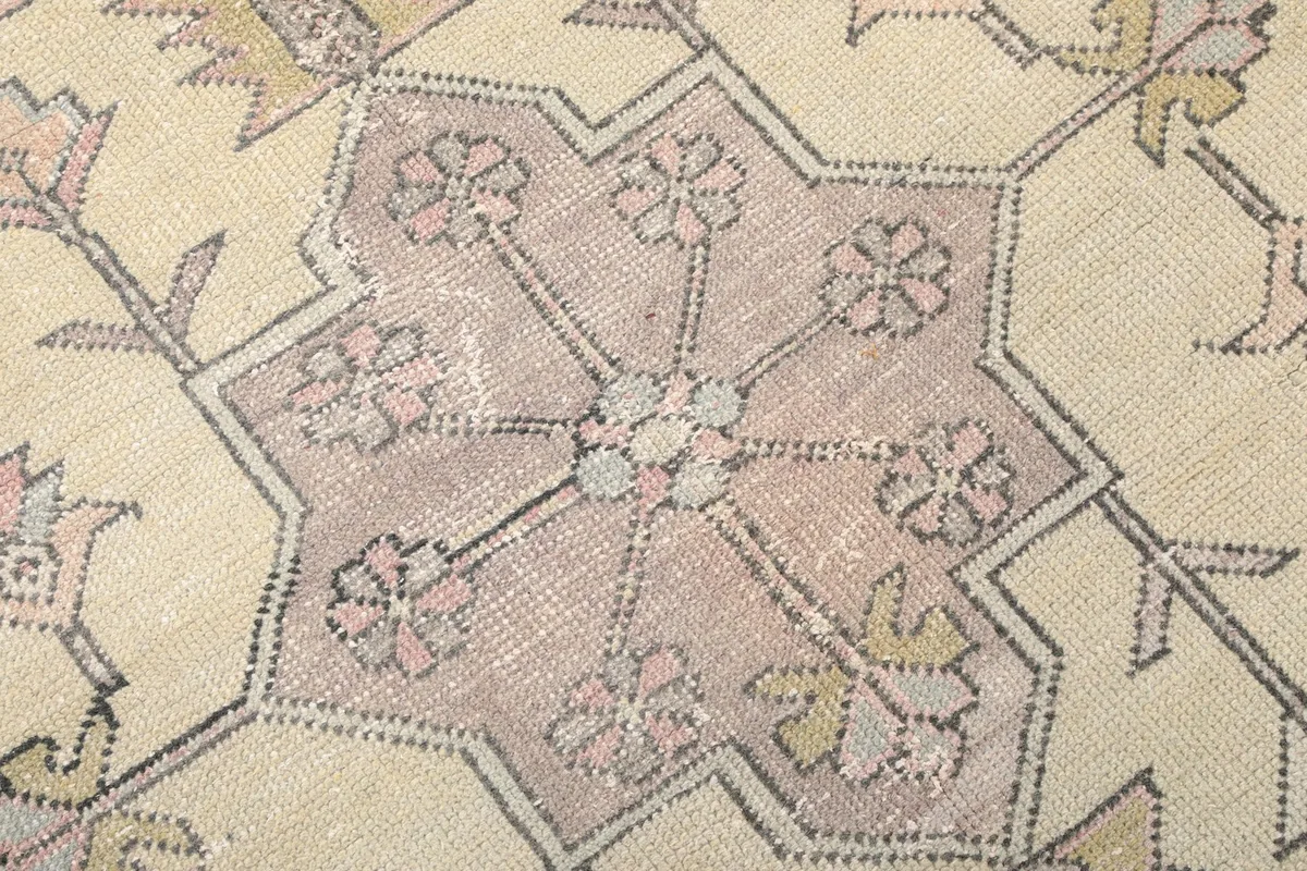 Extreme close-up of the medallion's core, revealing intricate patterns and color variations.