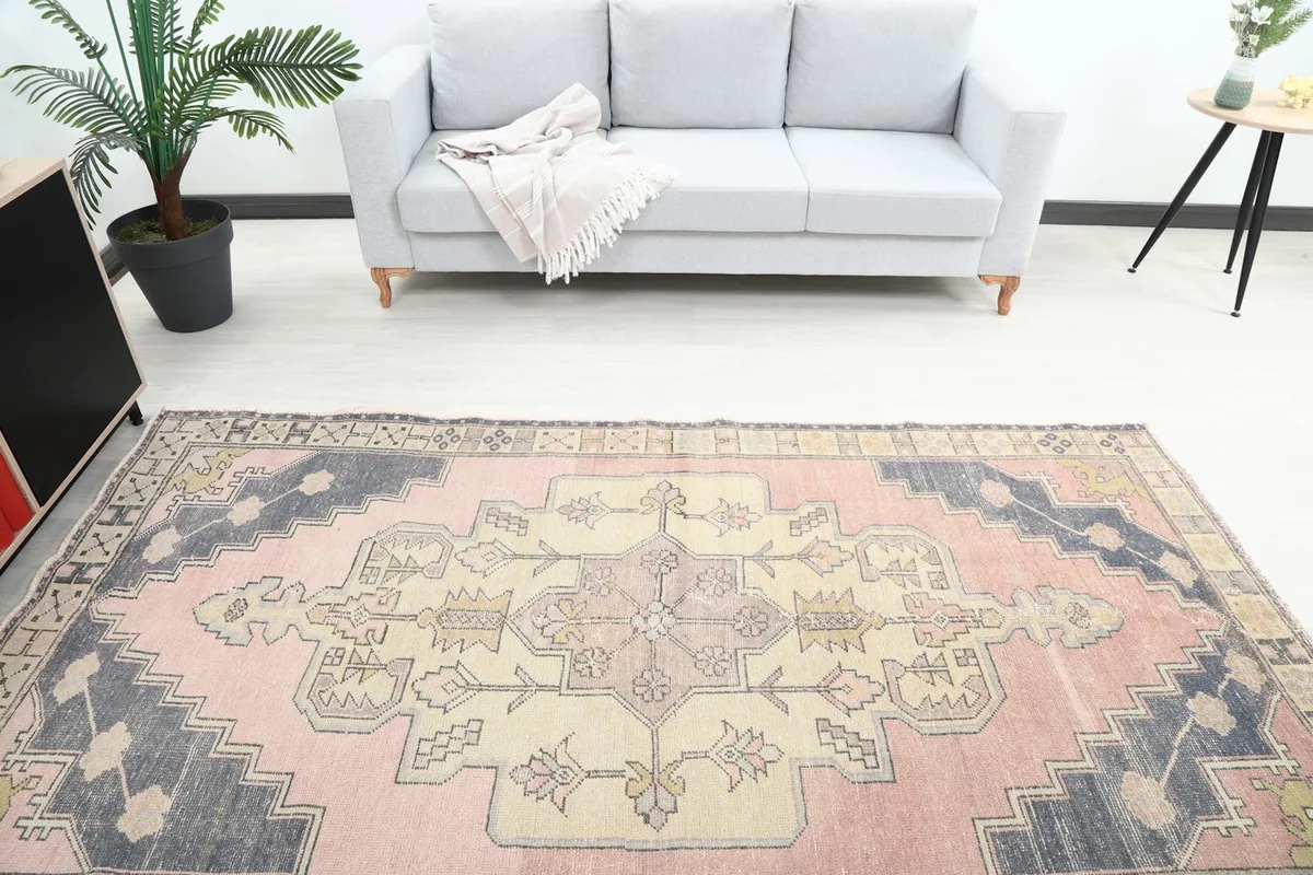 Overhead view of the rug's center and one end in a room, showing the medallion detail.