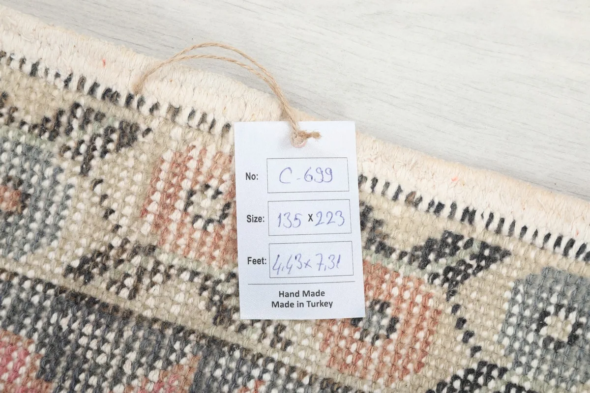 Product tag attached to the rug, displaying size and origin details.