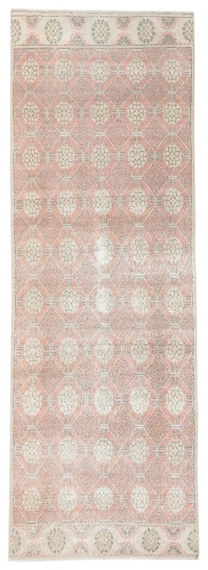 Full top view of the vintage rose geometric Anatolian runner rug on a white background.