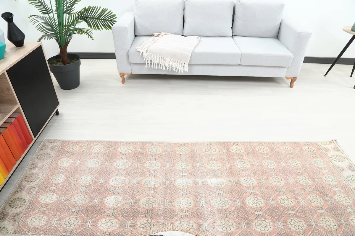 Overhead view of the rose geometric runner in a living space, showing its full length.