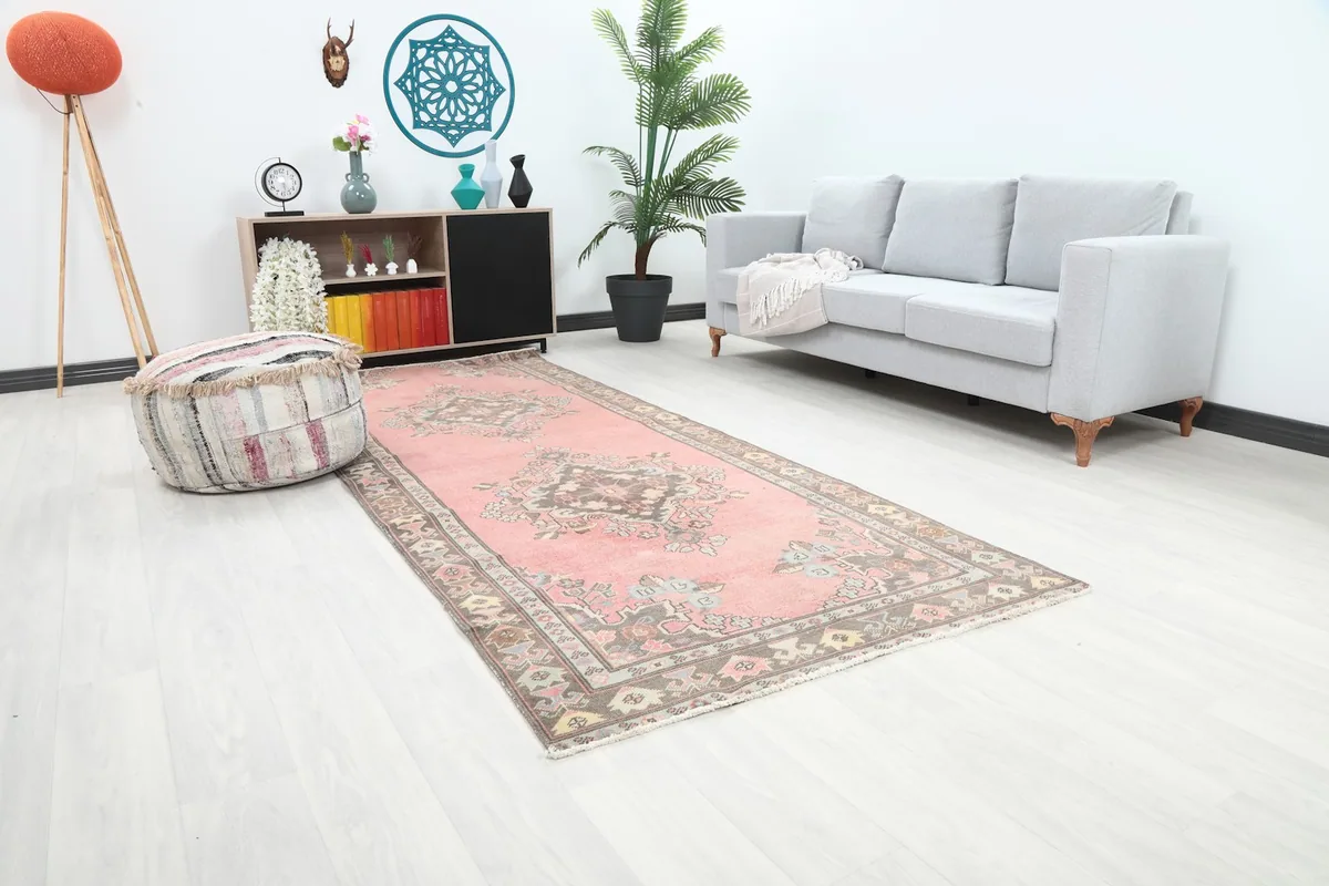 Angle view of the rose runner rug showing its length in a contemporary room setting