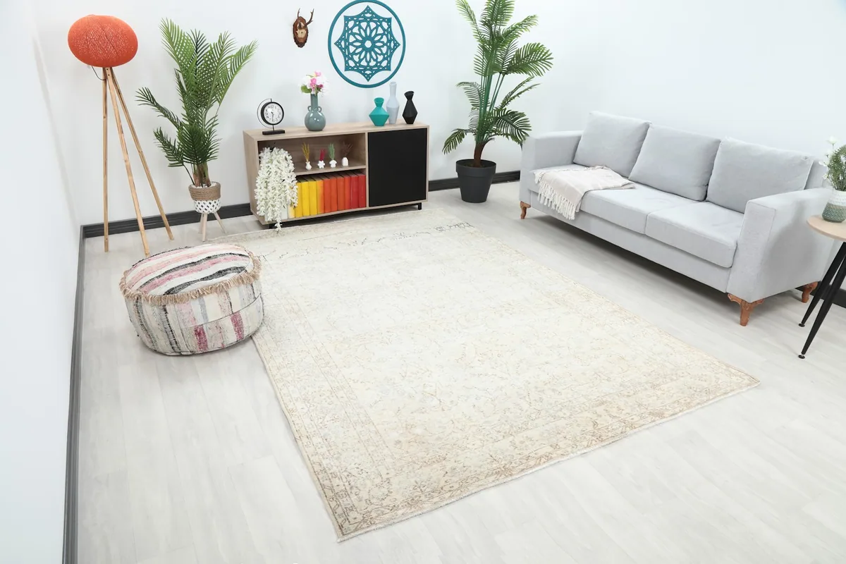 Angle view of the ivory floral rug in a modern living space, highlighting its placement.