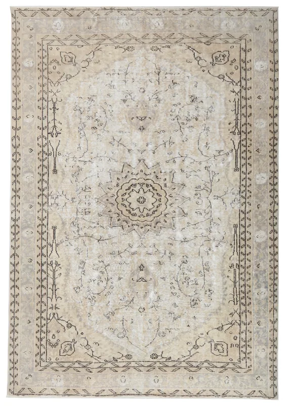 Full top view of the 6'4" x 8'10" ivory and beige Anatolian vintage rug with central medallion.