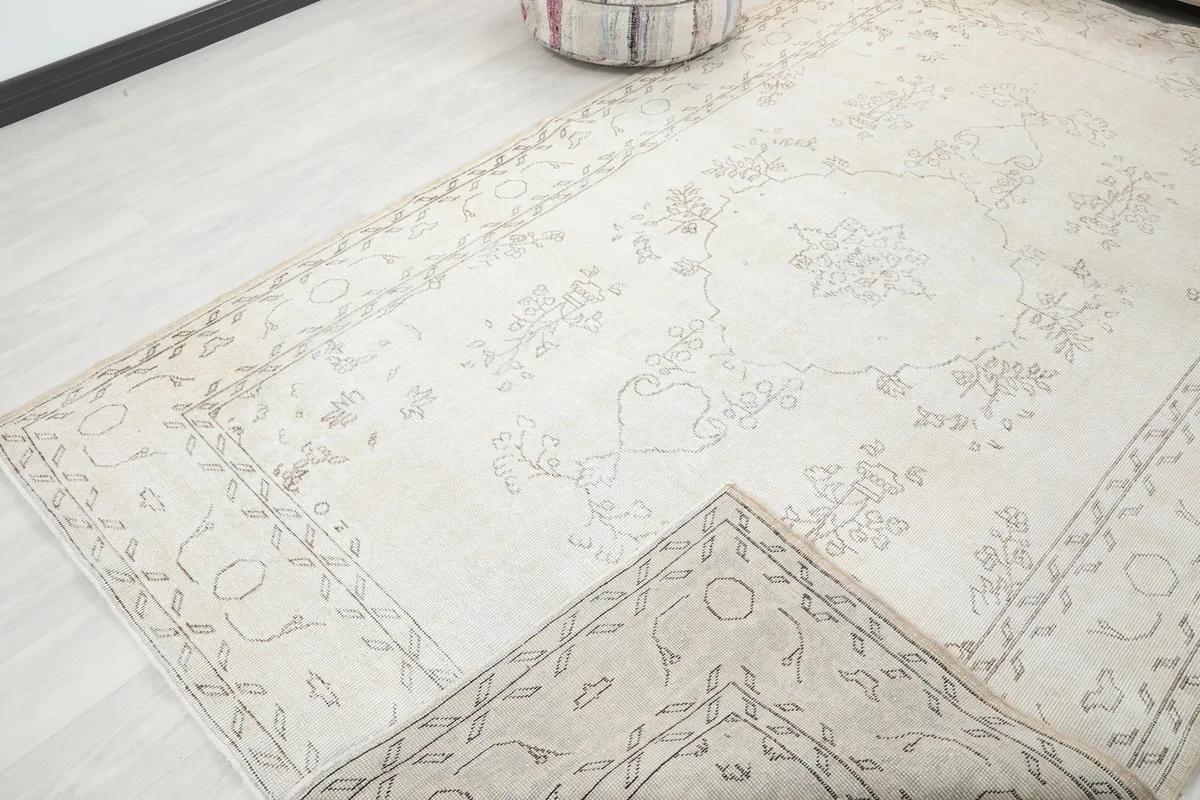 View showing a folded corner of the rug, illustrating its flexibility and pile