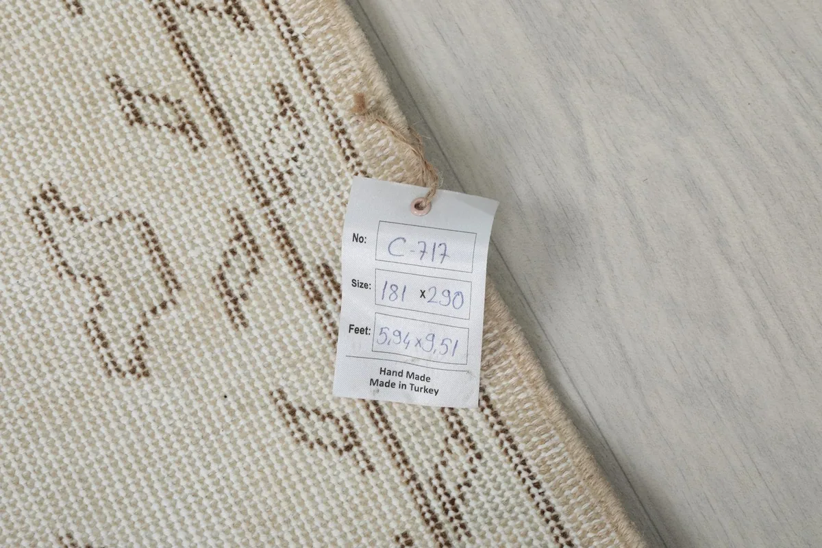Close-up of the rug's label, showing dimensions and origin details