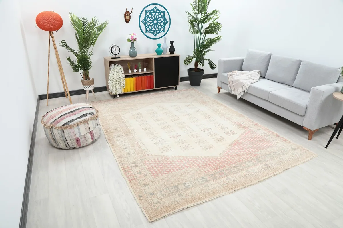 Angle view of the ivory and rose rug in a modern living space with light decor