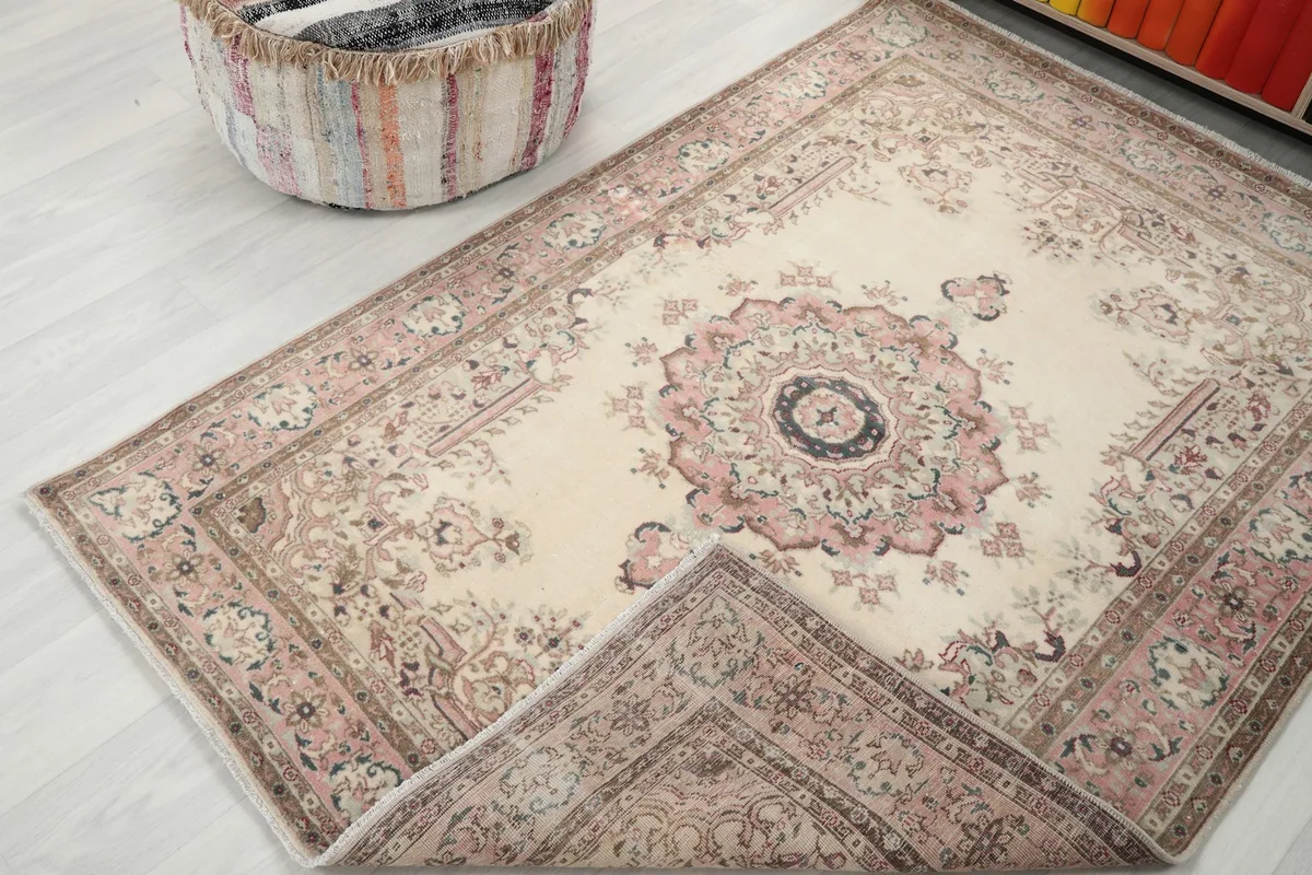 Rug with a corner folded over, showing the front and back weave from an angle