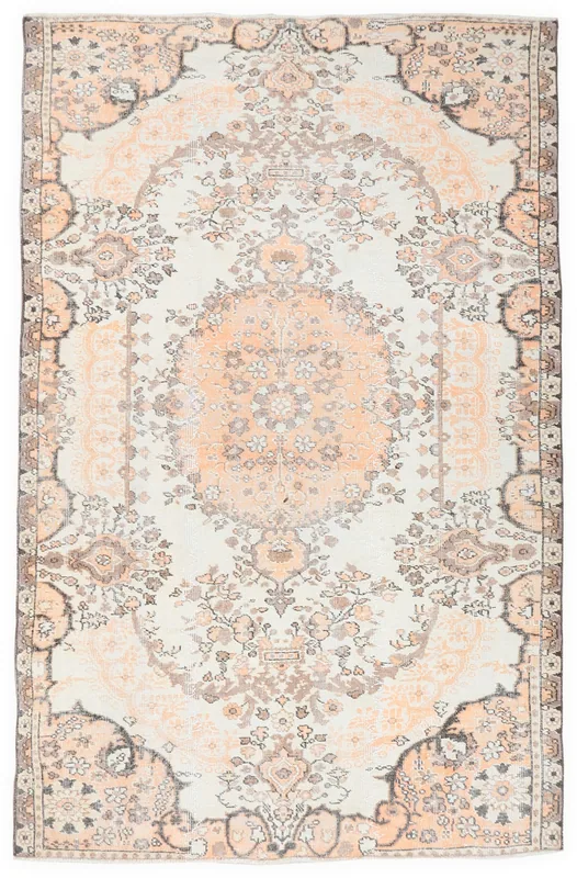 Full overhead view of the vintage ivory and orange Anatolian floral rug
