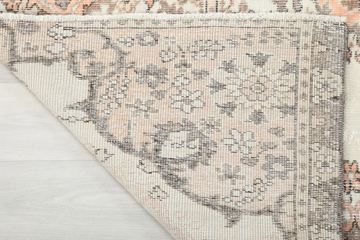 Close-up of the rug's back, showing the consistent knotting and foundation