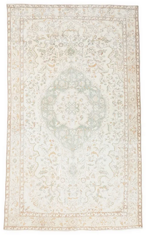 Full top view of the vintage ivory and green floral medallion rug on a white background