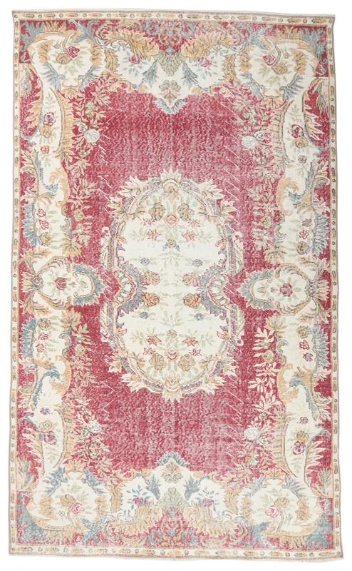 Full overhead view of the red and ivory vintage Anatolian area rug on a white background.