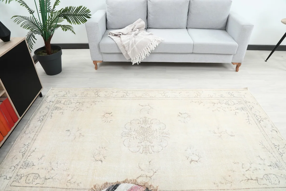 Overhead view of the rug in a living room, highlighting its central medallion and overall pattern