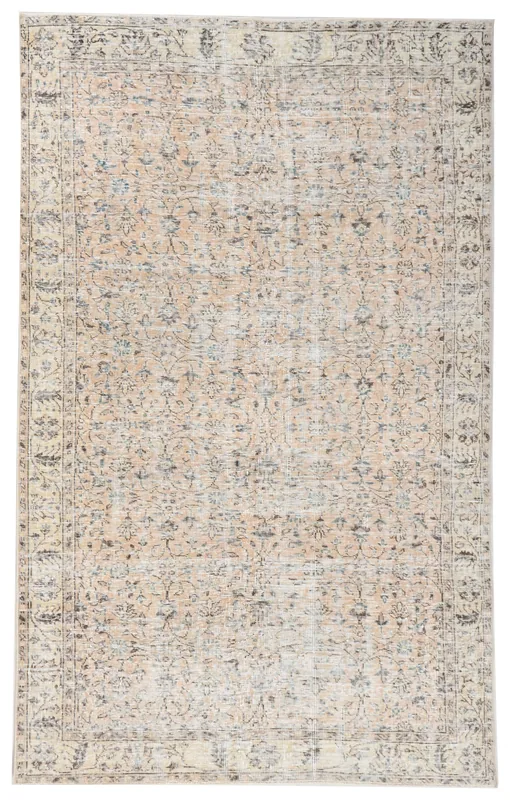 Full overhead view of the beige vintage Anatolian rug with floral and geometric motifs.