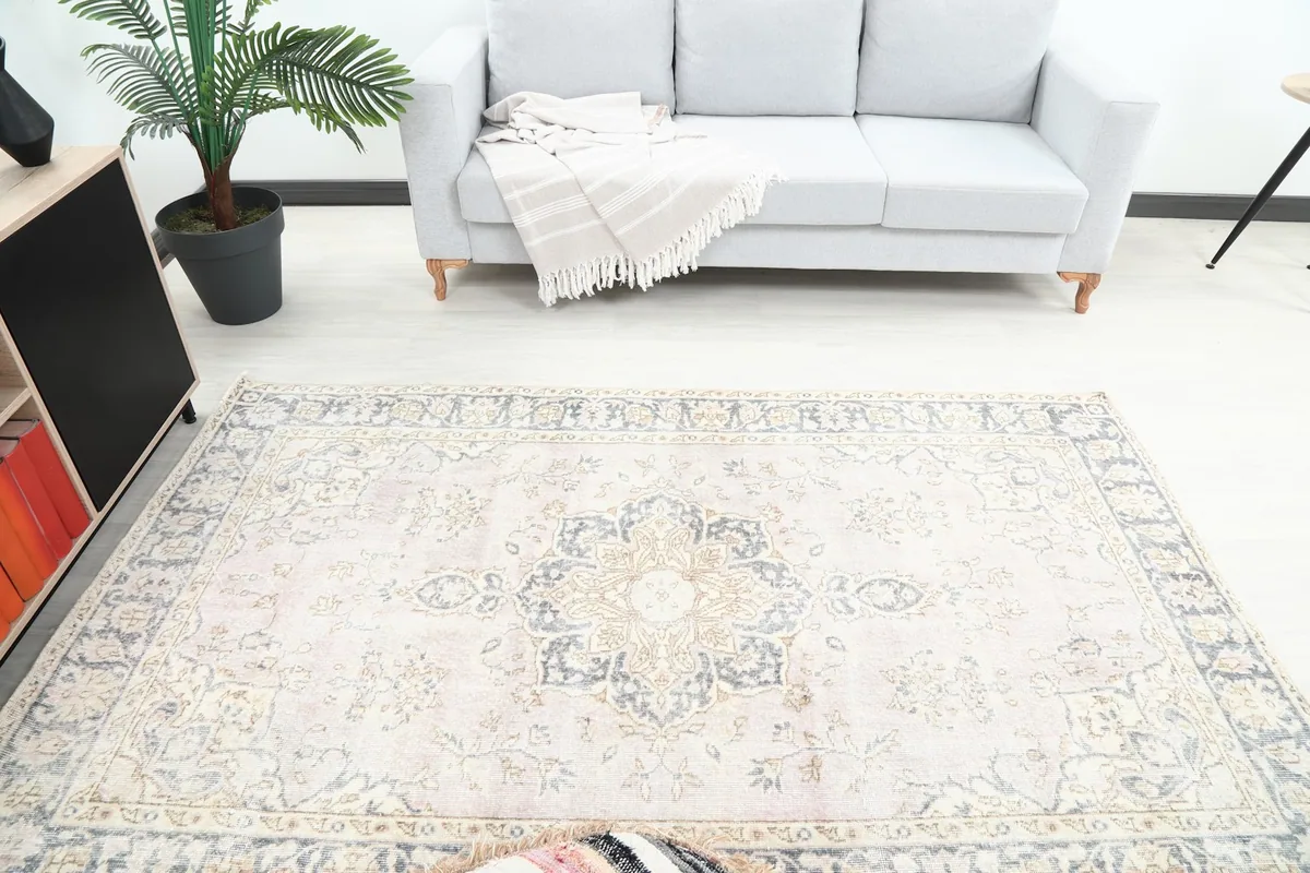 Overhead view of the rose rug in a room, showing its placement relative to furniture